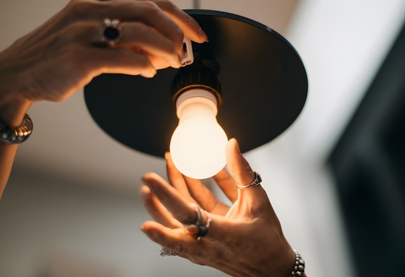 Handyman Fixing a Light Fixture